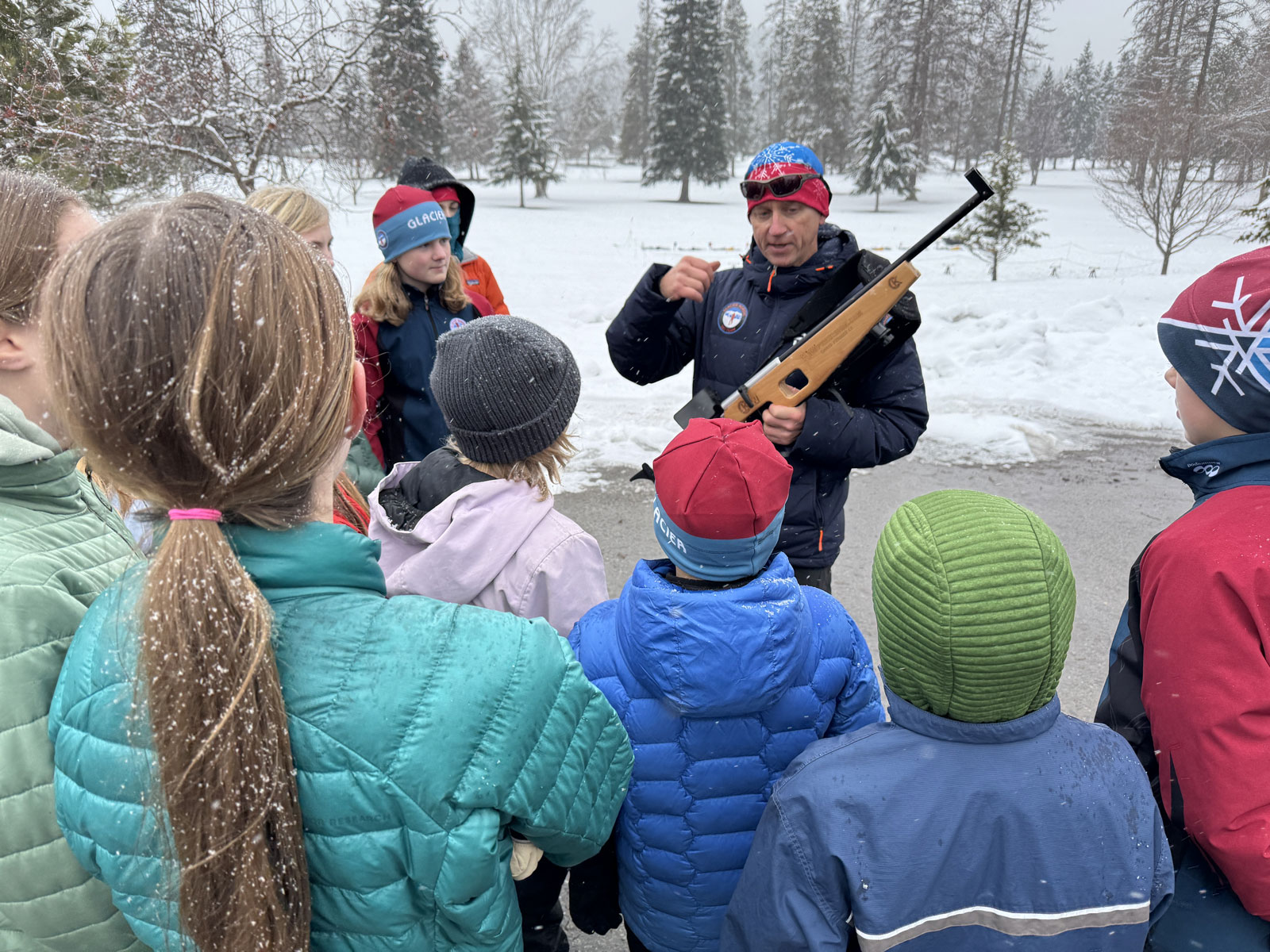Biathlon athlete holding rifle